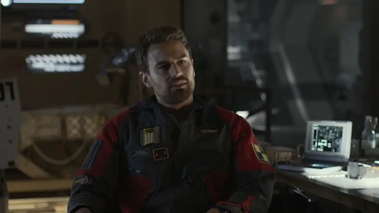 Theo James's George Almore sits in his lab in Archive