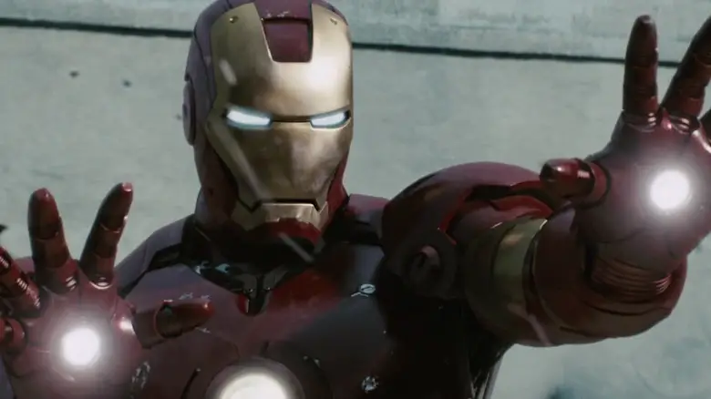 Robert Downey Jr's Iron Man aims his hand blasters in Iron Man.jpg