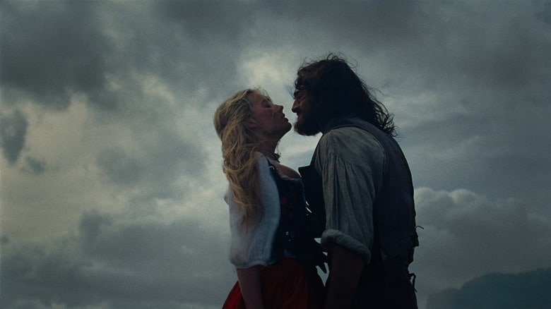 Cathy and Heathcliff embracing on the moors in Wuthering Heights