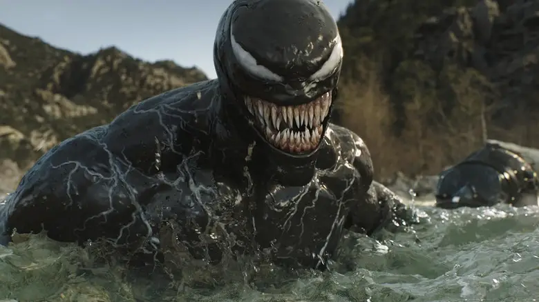 Venom smiling in the water in Venom: The Last Dance