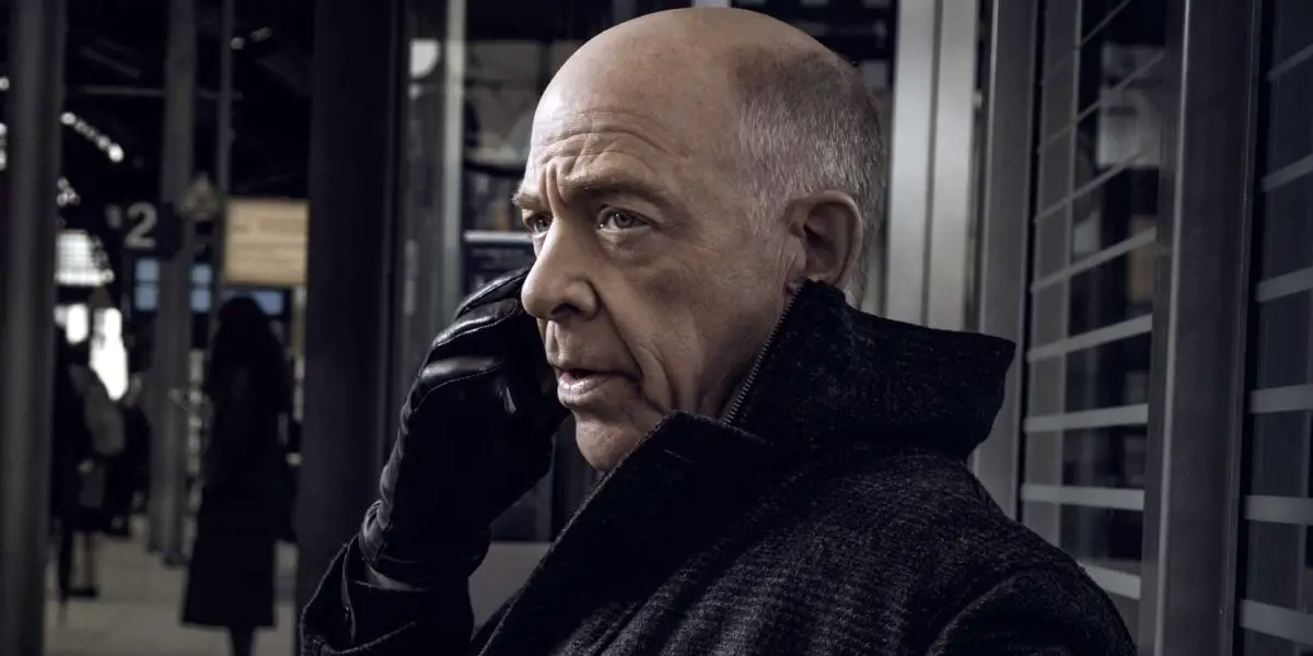 J.K. Simmons holding a phone in Counterpart