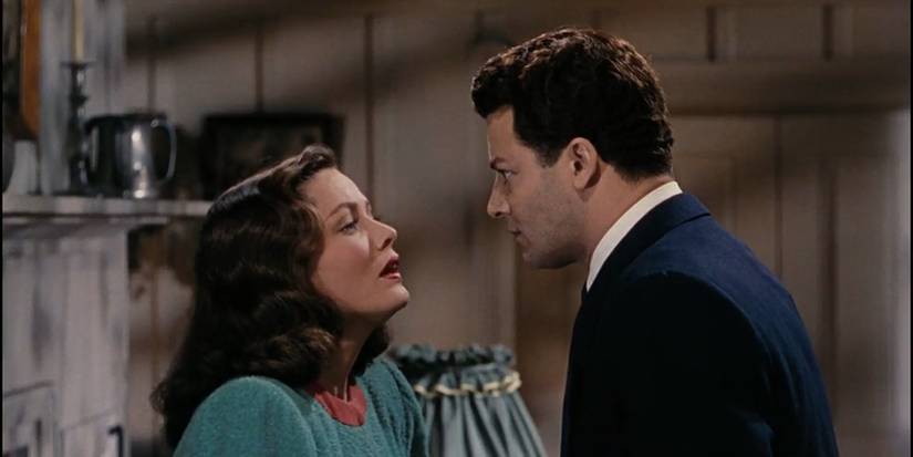 Ellen, played by Gene Tierney, staring imploringly up at Richard, played by Cornel Wilde, in Leave Her to Heaven