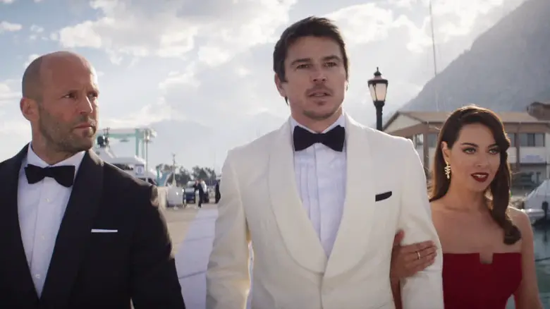 Orson and Sarah escortiing Danny onto the boat in Operation Fortune: Ruse de Guerre