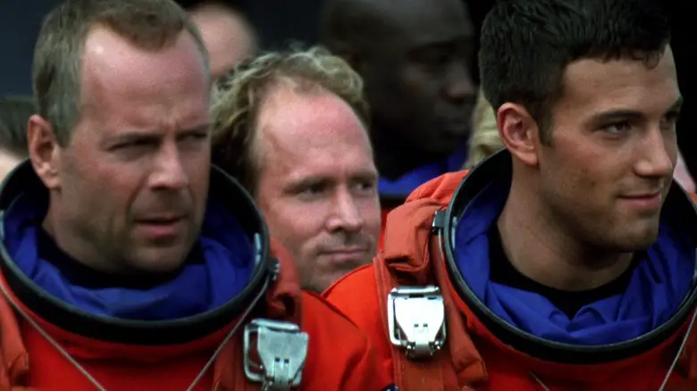 Bruce Willis' Harry S. Stamper walks alongside Ben Affleck's A.J. Frost in Armageddon