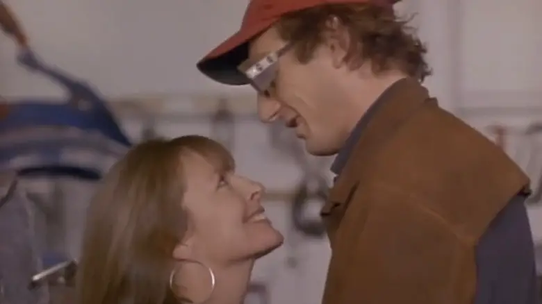 Diane Keaton's Anna Dunlap looks up at Liam Neeson's Leo Cutter as they embrace in The Good Mother