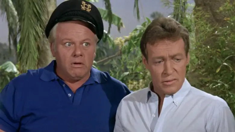 Russell Johnson's Professor Roy Hinkley stands next to Alan Hale Jr's Captain Jonas Grumby in Gilligan's Island