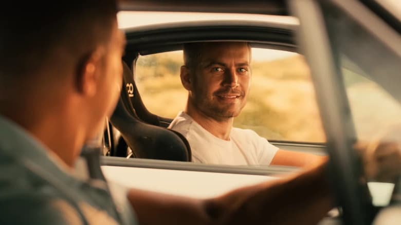 Brian smiling at Dom as he's about to drive away in Furious 7