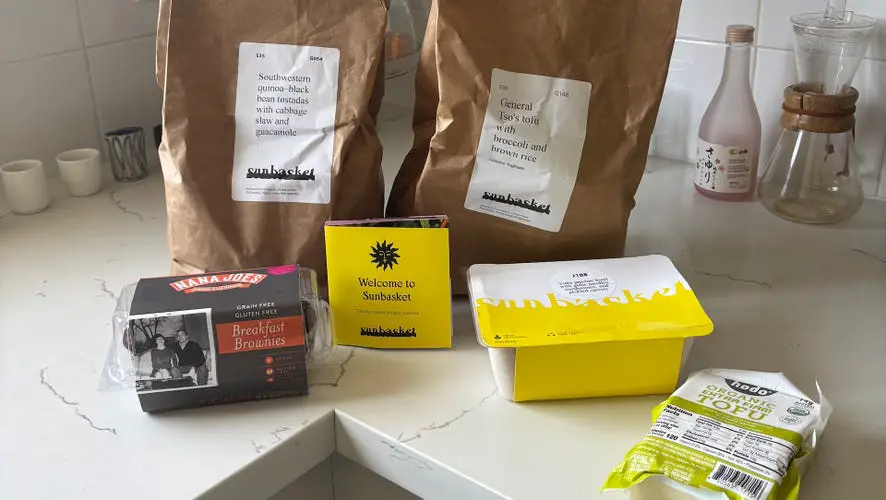 Sunbasket packaging on a white marble countertop.