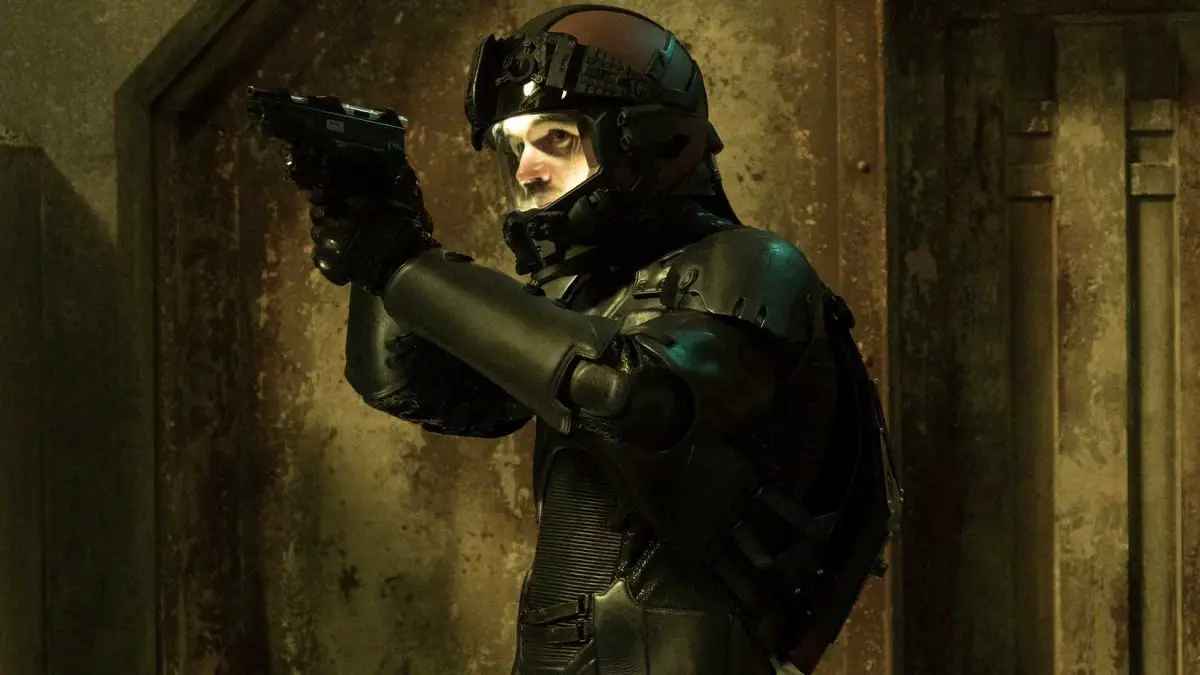 Holden taking aim in a space suit in The Expanse