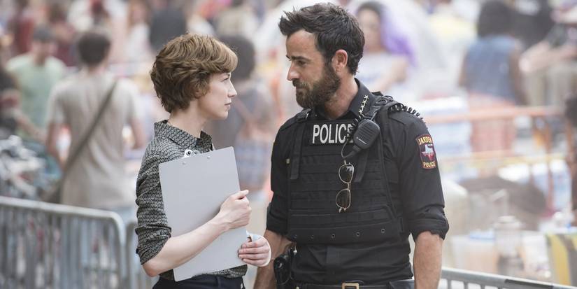 Nora and Kevin (in a cop uniform) stand outside in 'The Leftovers'.