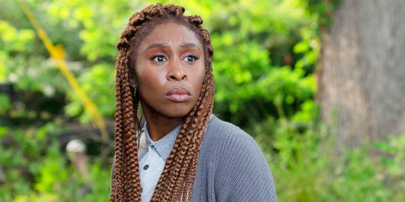 Cynthia Erivo as Holly Gibney looking at something off-screen in the woods in The Outsider.