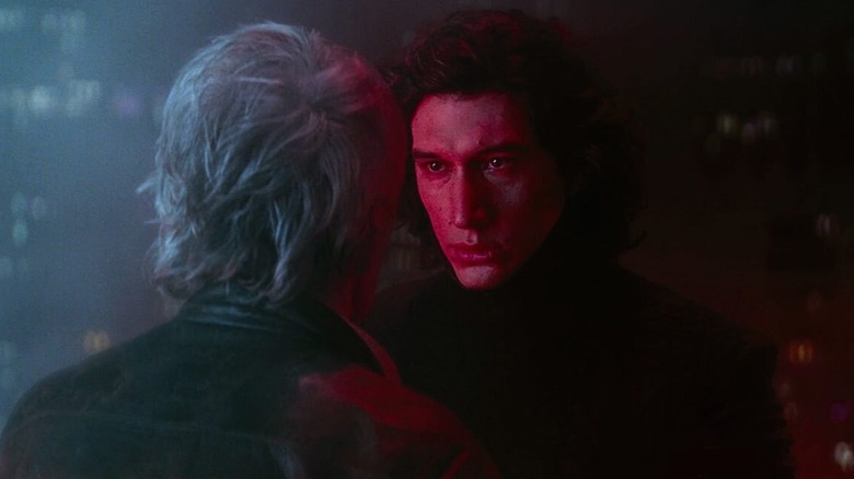 Adam Driver as Kylo Ren killing Harrison Ford as Han Solo in Star Wars: The Force Awakens