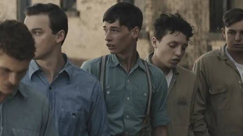 Jacob Lofland's Snoggs stands amid a group of school boys in 12 Migty Orphans