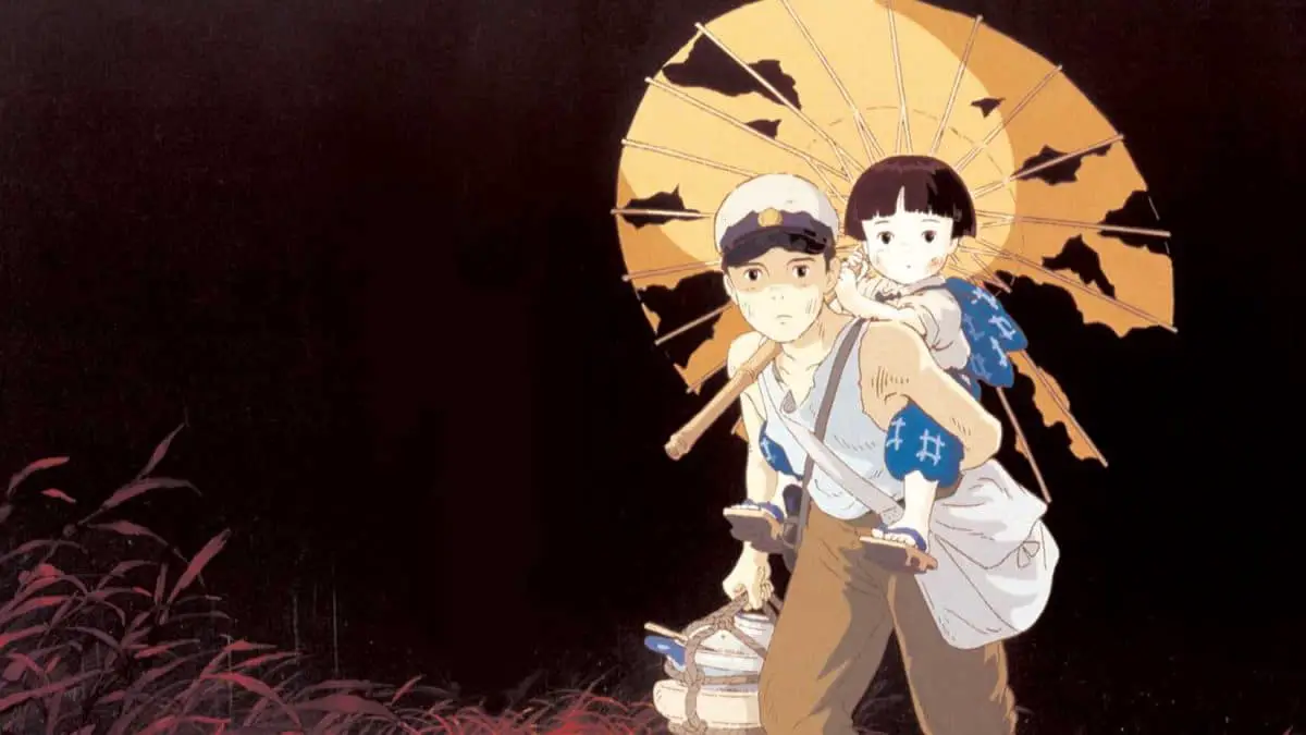 A man carrying a child on his back in Grave of the Fireflies