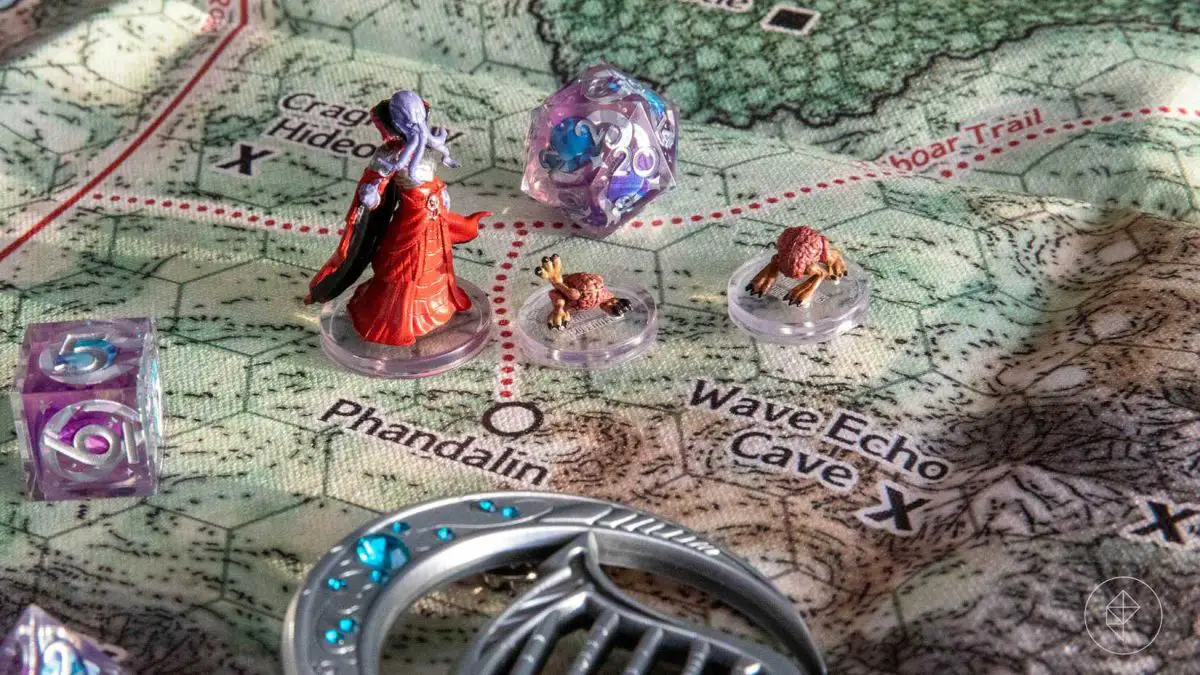 A canvas map of the Sword Coast region with Dungeons and Dragons miniatures and dice sitting on top of it.