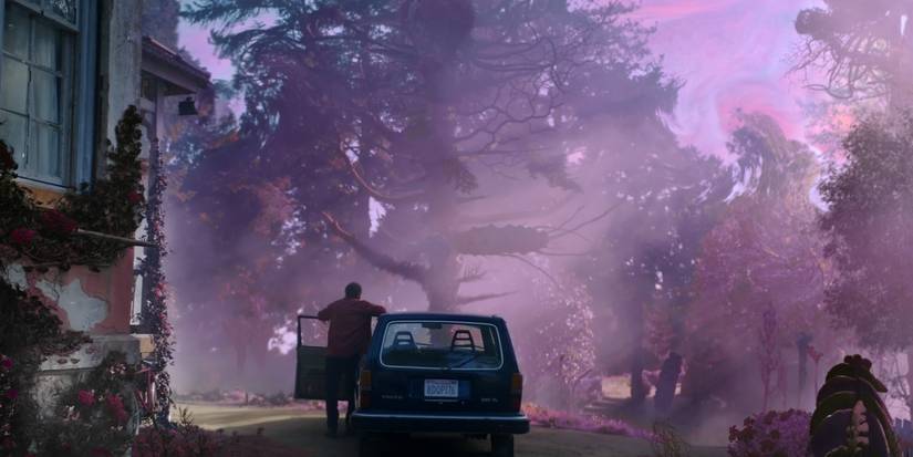 A man stands by his car as a mysterious purple glow glistens over his property in Color Out of Space.