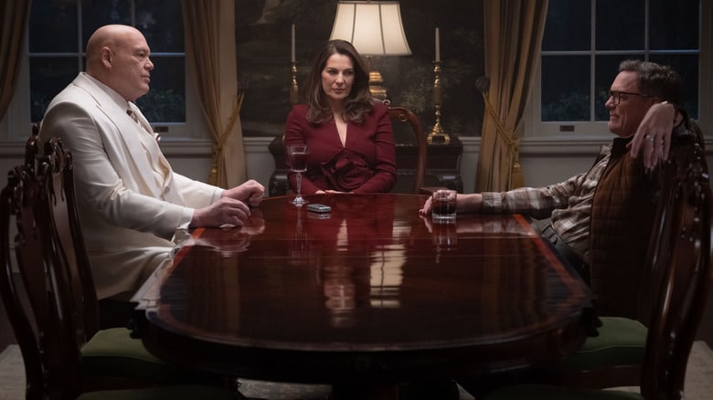 Vincent D'Onofrio as Wilson Fisk seated at a dinner table with Ayelet Zurer as Vanessa Fisk and Matthew Lillard as Mr. Charles in Daredevil: Born Again