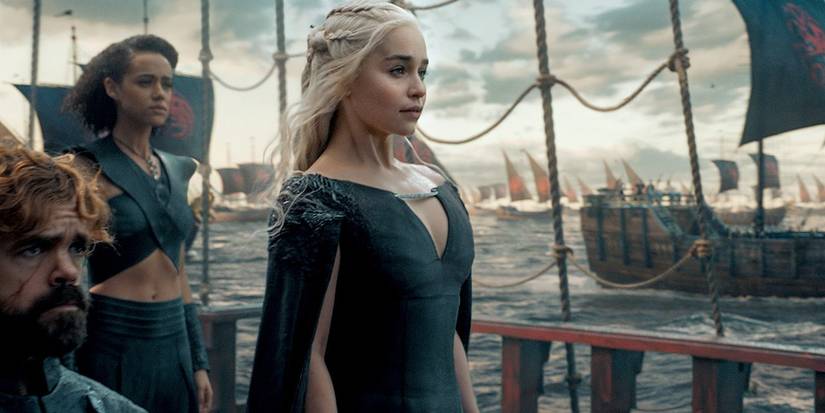 Daenerys Targaryen (Emilia Clarke) on a ship with her advisors, sailing for Westeros in Game of Thrones.