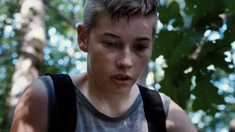 Jacob Lofland's Owen Briggs looking shaked up in a forest in Little Accidents