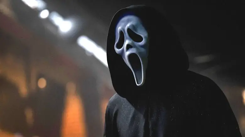 A close up of Ghostface in the auditorium in Scream 7
