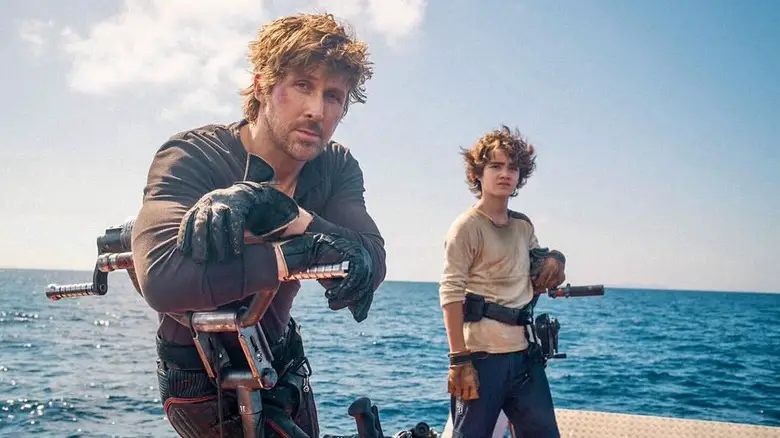 Ryan Gosling on set in the water with Flynn Gray behind the scenes of Star Wars: Starfighter