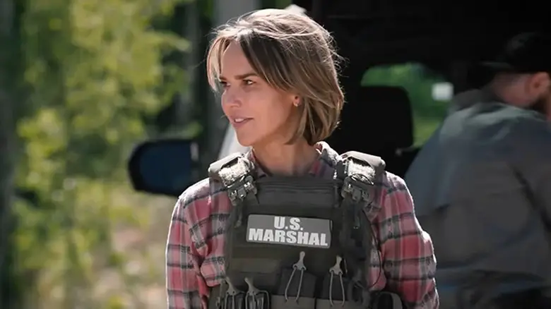 Arielle Kebbel as Belle Skinner in her U.S. Marshal vest in Marshals