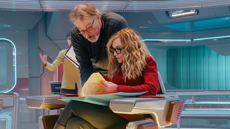 Jonathan Frakes and Holly Hunter reading script on the set of Star Trek: Starfleet Academy with Tig Notaro in background