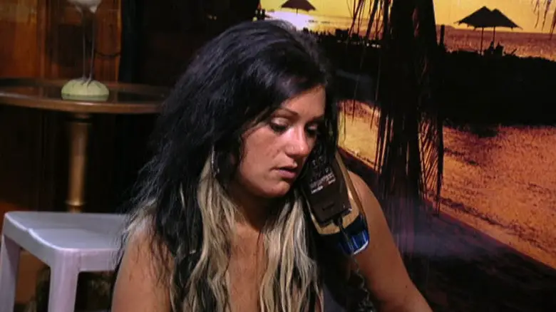 Jwoww speaks on a wired phone in Jersey Shore