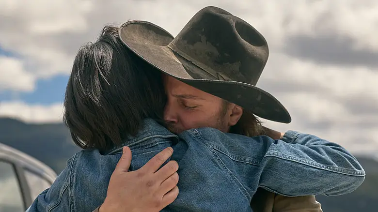 Luke Grimes' Kayce Dutton hugs Kelsey Asbille's Monica Dutton in Yellowstone.jpg
