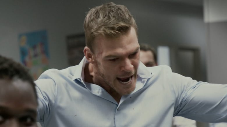 Alan Ritchson's Bob yells as he stands in an office in Office Uprising