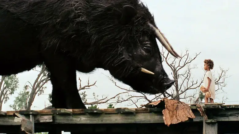 Hushpuppy facing down a giant boar in Beasts of the Southern Wild