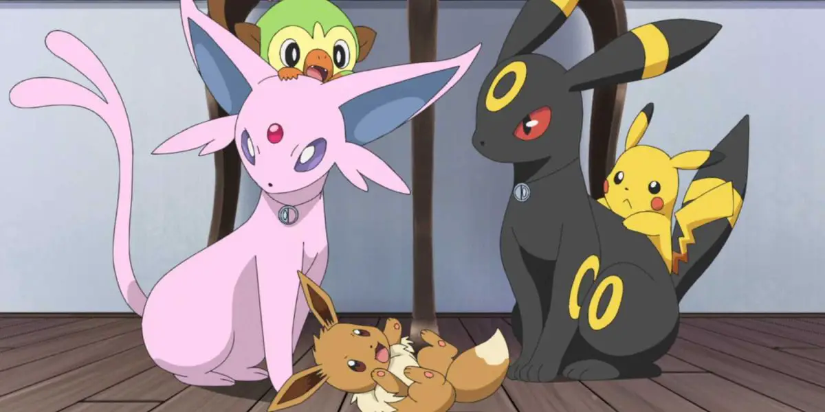 Pokemon screenshot of Espeon and Umbreon with other Pokemon playing around them