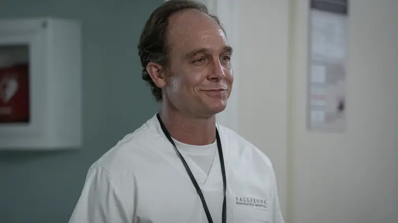 Ethan Embry as Marco wearing scrubs in a mental institution in Scream 7