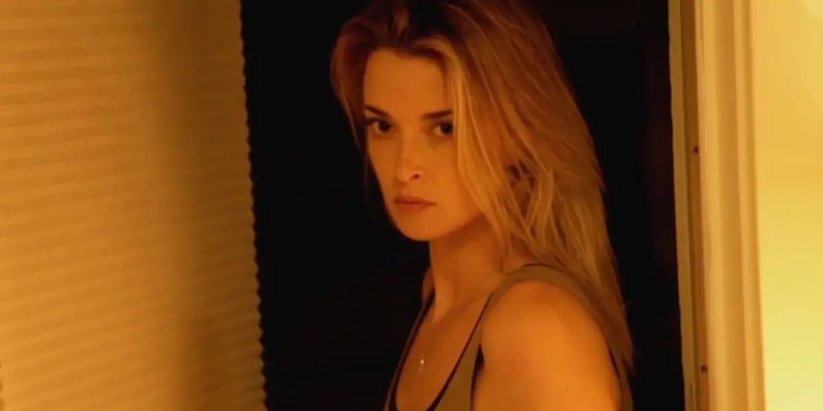 A young woman looking intently ahead in Coherence