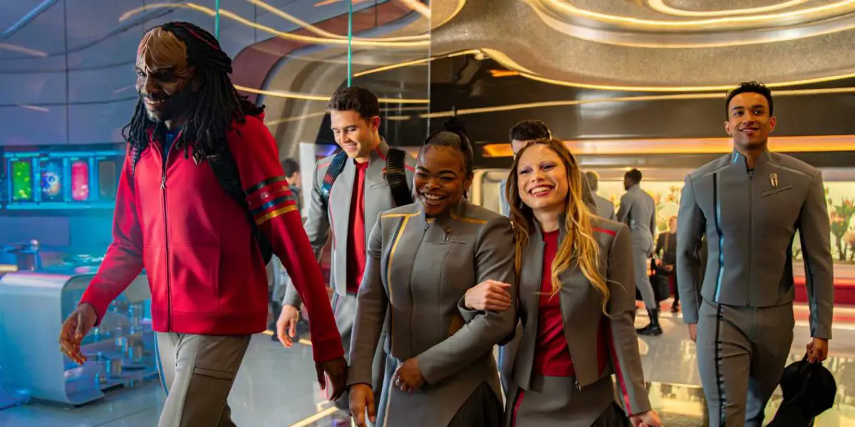 Starfleet Academy group shot of students happily walking down hall