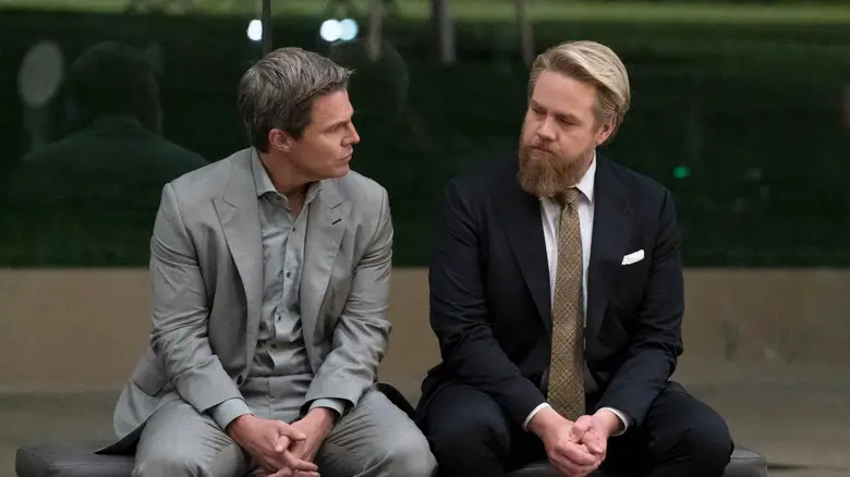 Ted Black and Stuart Lane sit on a bench together in Suits LA