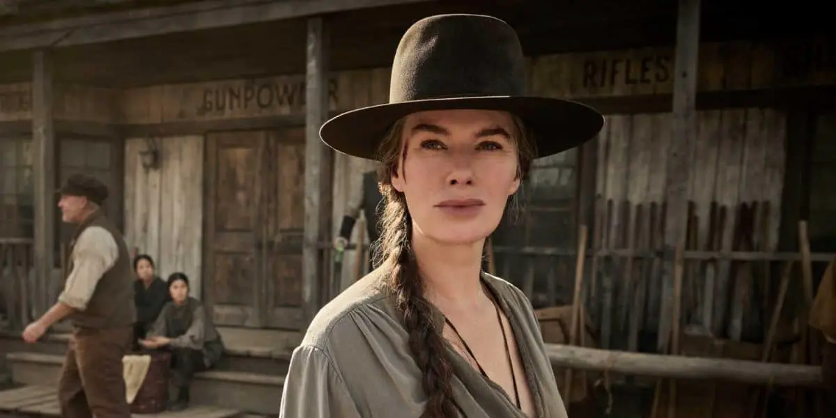 Lena Headey as Fiona Nolan standing in town wearing a cowboy hat in The Abandons