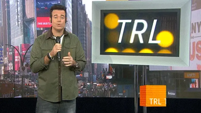 Carson Daly stands in the studio overlooking Times Square in Total Request Live