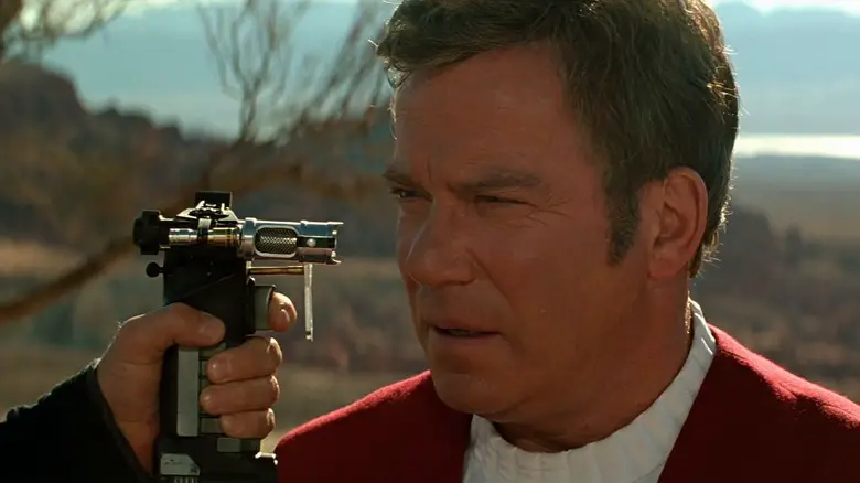Admiral Kirk with a phaser to his face in Star Trek: Generations