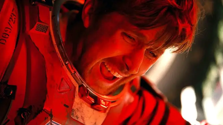 Close up of Grace shouting in red light