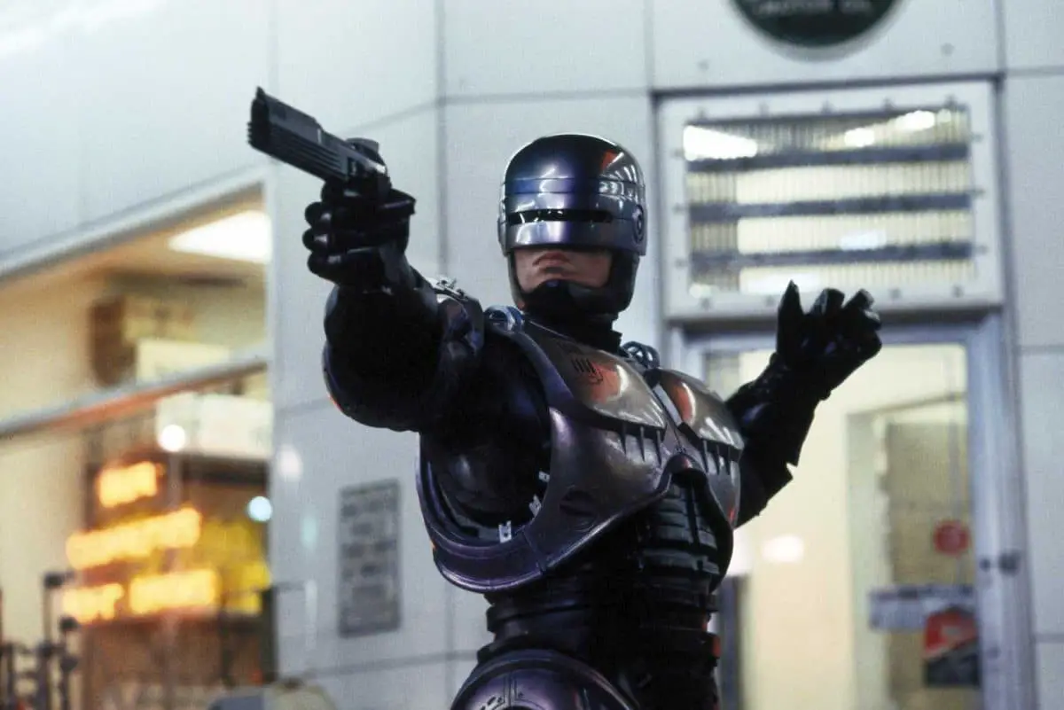 Robocop pointing a gun in Robocop.